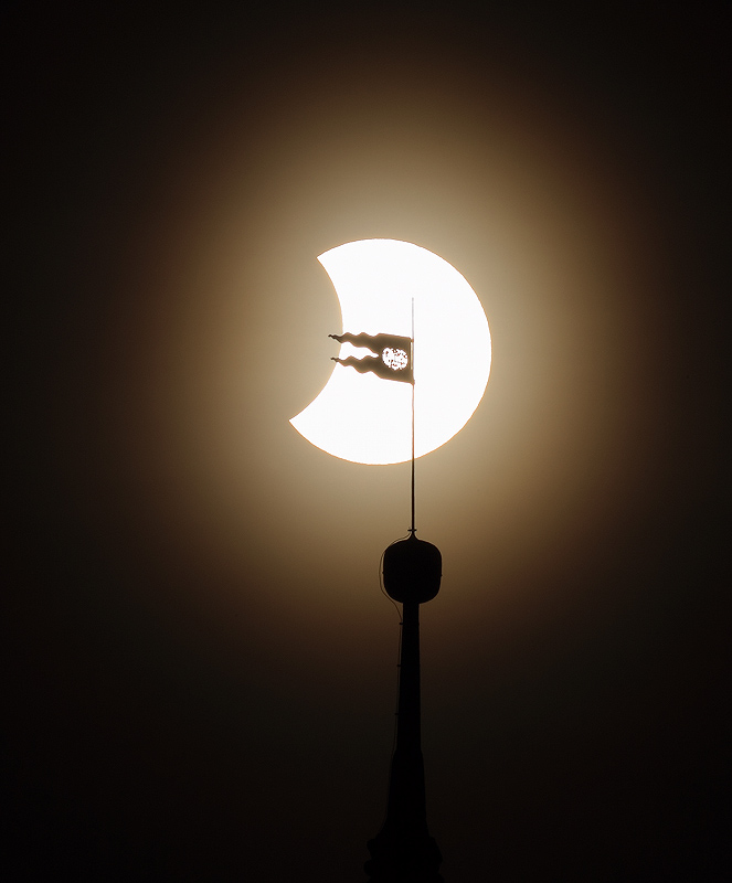 Partial solar eclipse on the 4th January 2011 with top of the castle tover in Český Krumlov