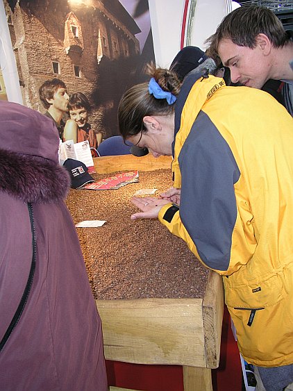 Presentation of the town of Czech Krumlov at the trade fair in Munich, exposition of the Czech Republic, searching for little garnets in the 