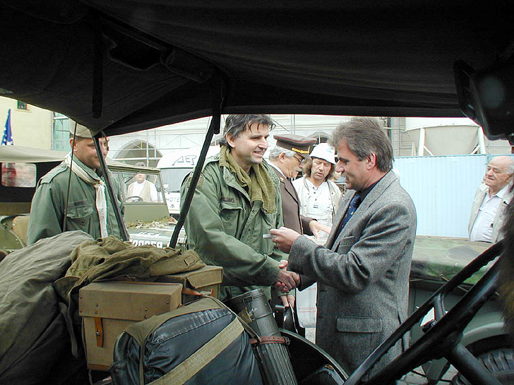 Vice Mayor of town Ceský Krumlov Miloš Michálek hands over the memorial plaque to the commander of American Jeep at town square in Český Krumlov. Celebrations of the 56th anniversary of liberation by U.S. army in May 4 2001