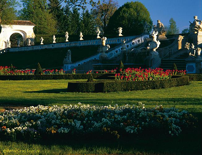 Fountain in the blossoming castle garden